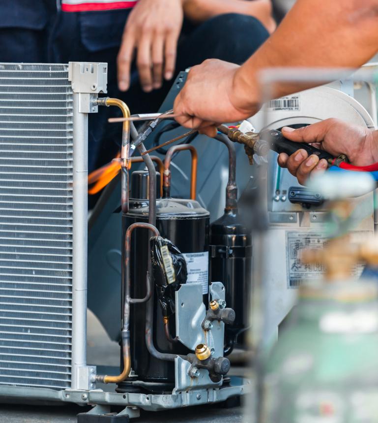 Frosstec technician working on refrigeration equipment